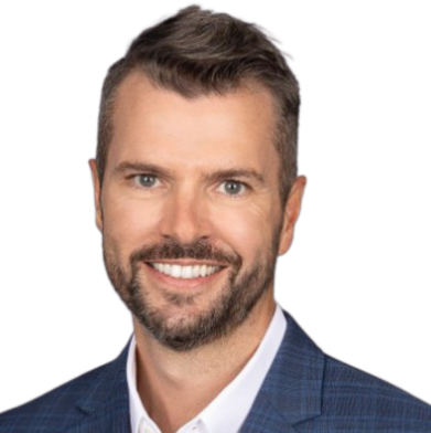 Head-and-shoulders portrait of a smiling man in a blue suit and white shirt against a white background